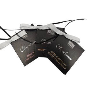 chatsworth chocolates gift tag group shot and punched holes with grey and black ribbons